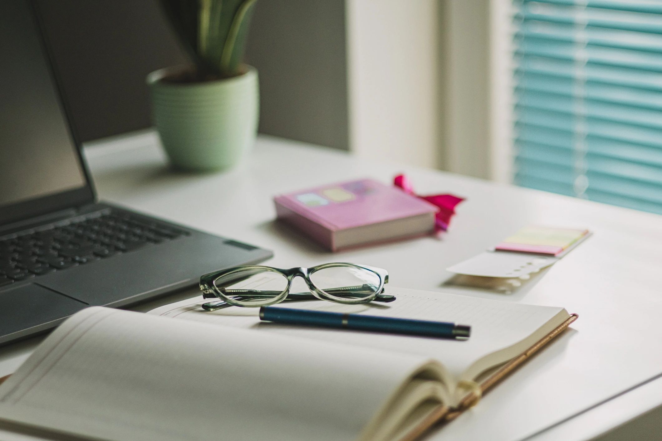 Content planning workspace with laptop and desk essentials